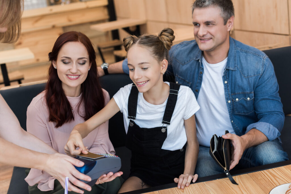 parents letting daughter use their credit card to pay at restaurant