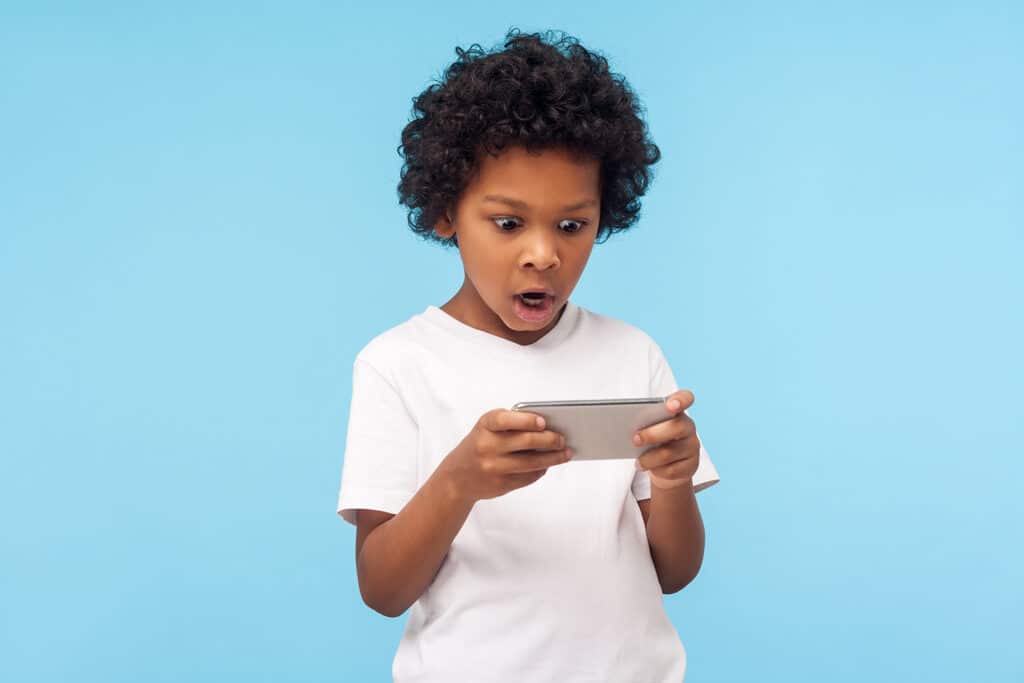 shocked child looking at phone