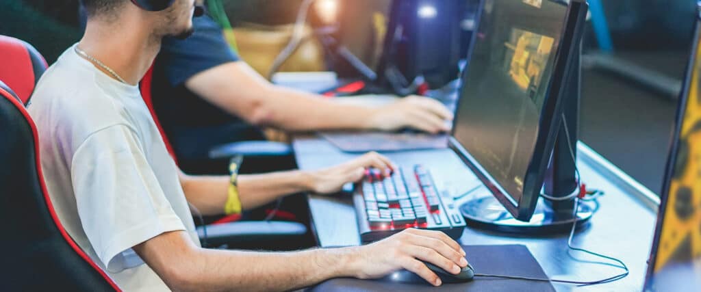 teen boy gaming on a computer