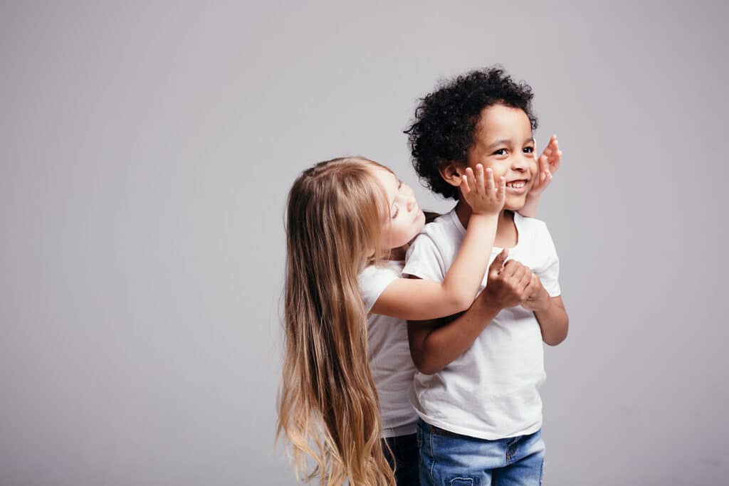 a little girl and boy playing