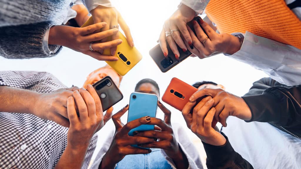 group of people holding cell phones