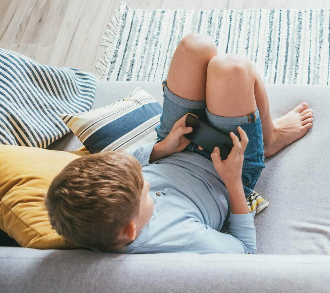 Boy playing games on phone